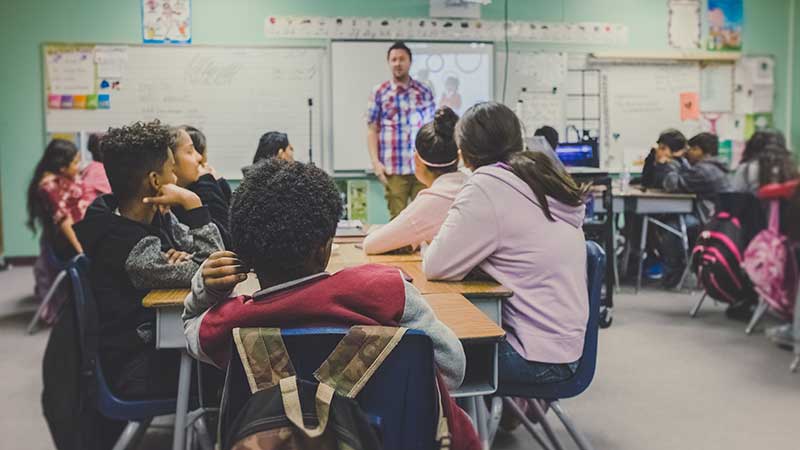 Teacher in front of classroom