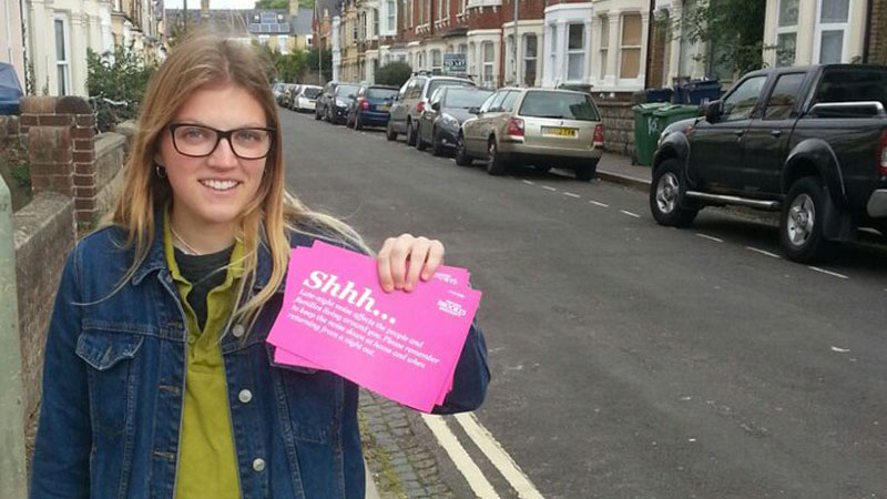 Student giving our flyers
