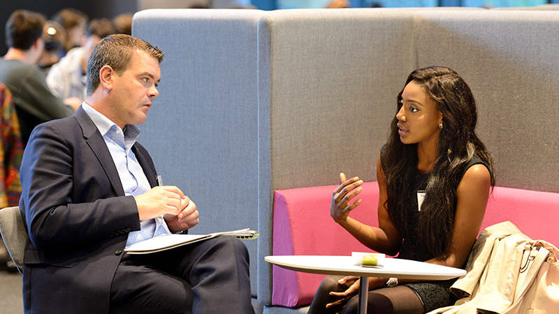 Professionals networking at university