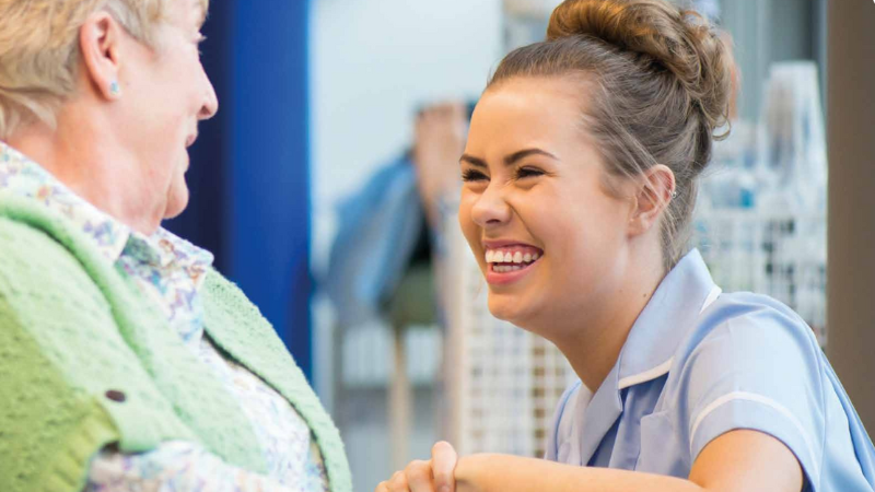Nursing student with patient