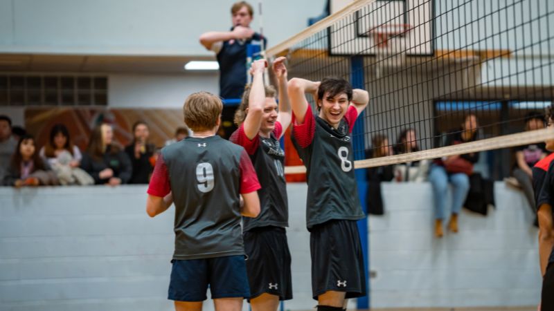 Women's Volleyball team celebrating