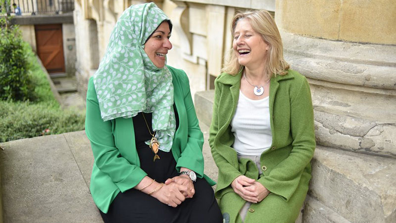 two women conversing