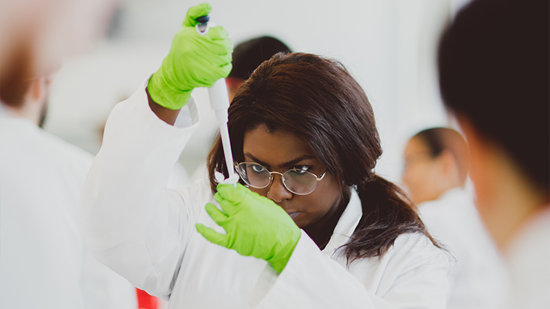 Researcher with pipette