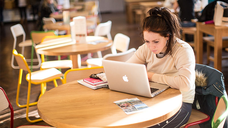Girl studying on her laptop Female Philosophy and Sociology, BA or BSc (Hons) student studying on campus at Oxford Brookes University