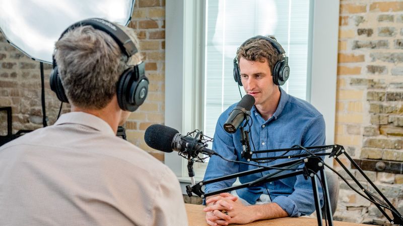 two people recording a podcast episode