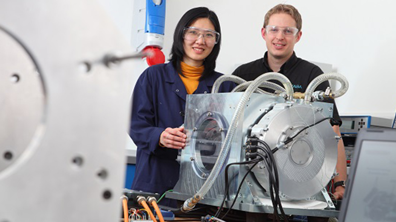 Students working on electric motor