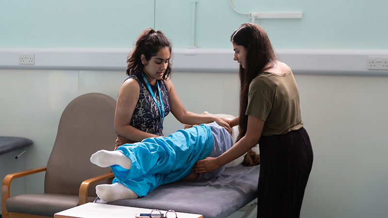 two students in a subject workshop