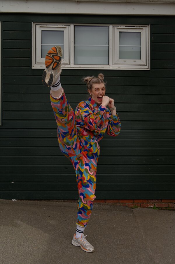 Instructor kicking high