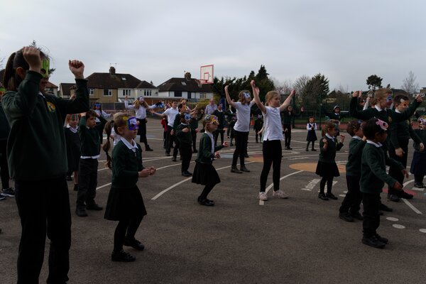 Pupils dancing in the playground