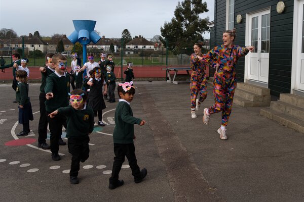 Pupils and instructors dancing in the playground