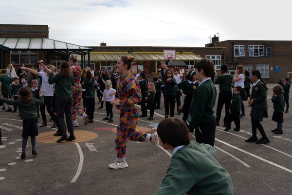 Pupils dancing in the playground