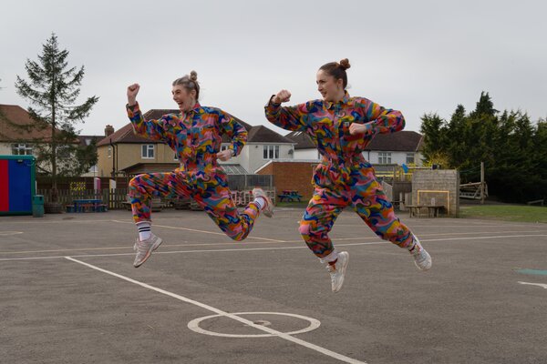 Instructors dancing in the playground