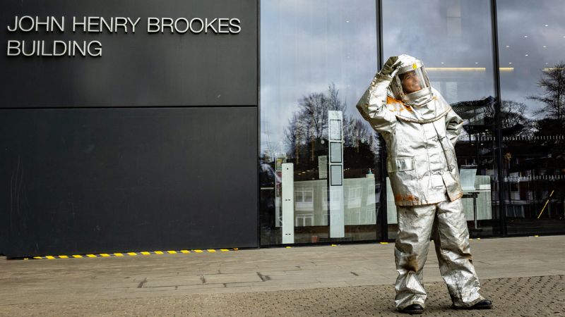 A firefighter outside the John Henry Brookes Building