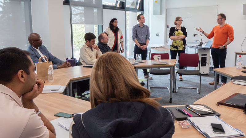 Staff sat in a classroom
