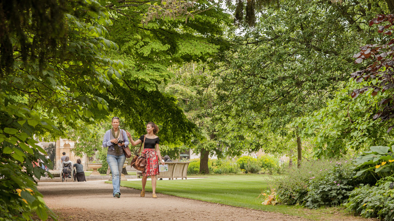 Two volunteers in the gardens.