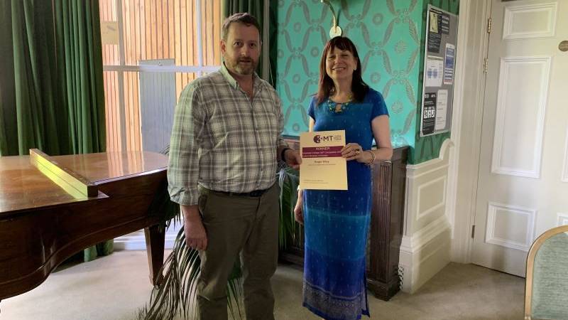student receiving certificate