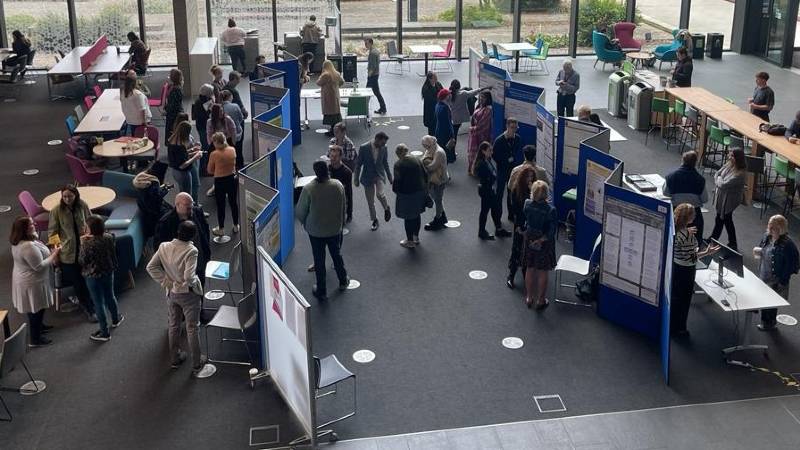People looking at poster displays