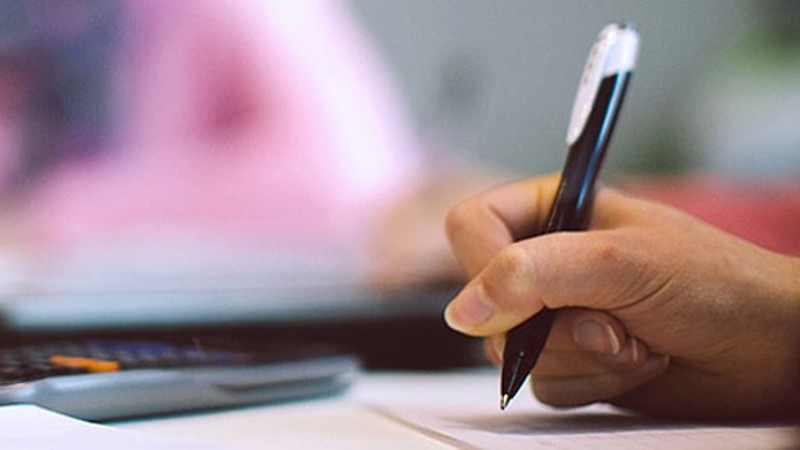 A person holding a pen