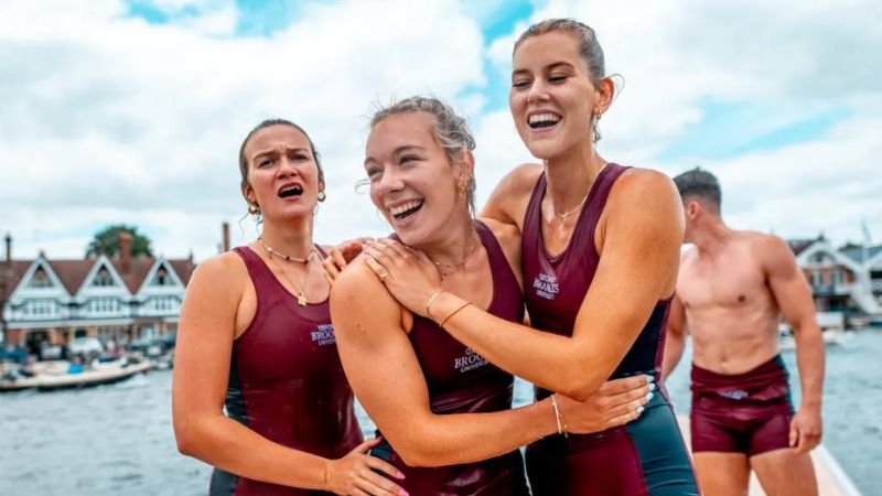 Three Brookes Rowers celebrating after race 