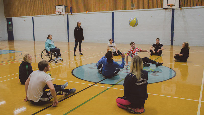 Researchers observing a physical activity session