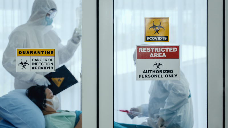 Medical Staff in PPE caring for patient