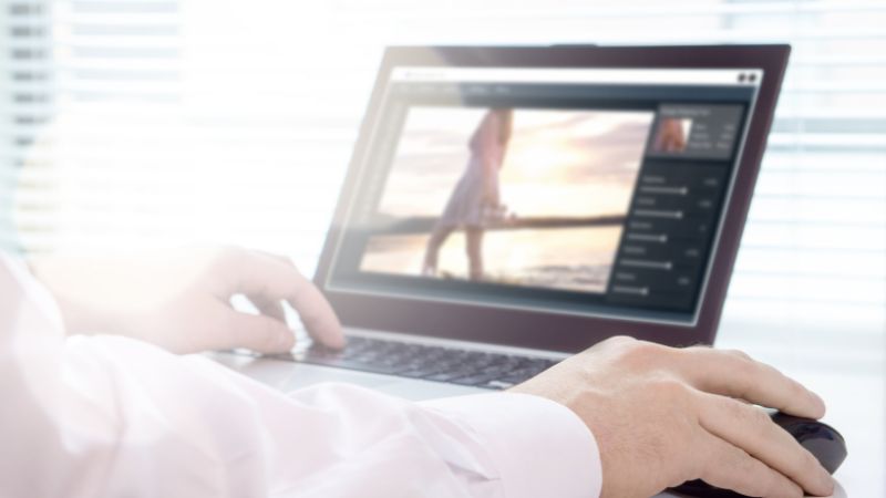 laptop with a video editor software on screen