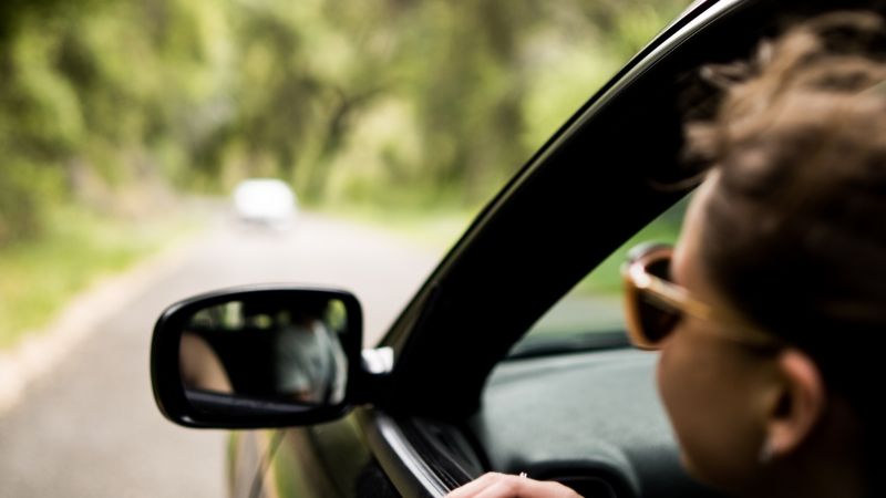 person in a car looking out of the car