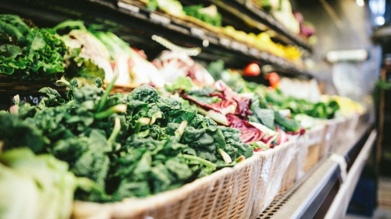 a vegetable aile at a supermarket with fresh produce