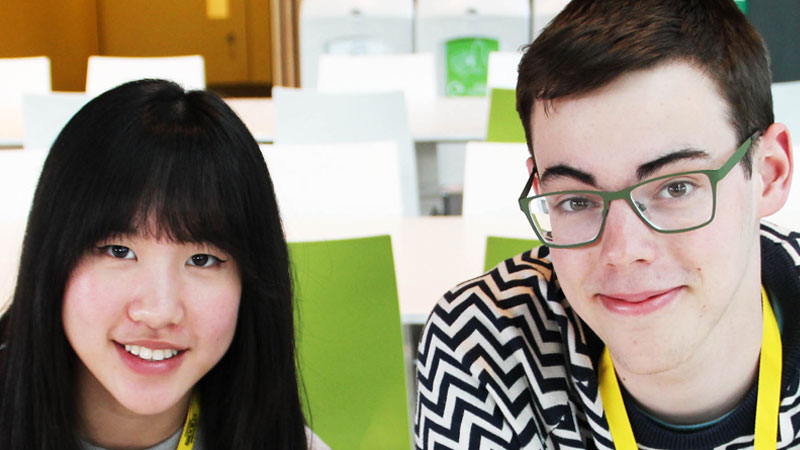 Two students looking at the camera