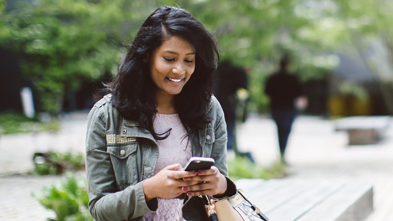 Student checking her mobile phone