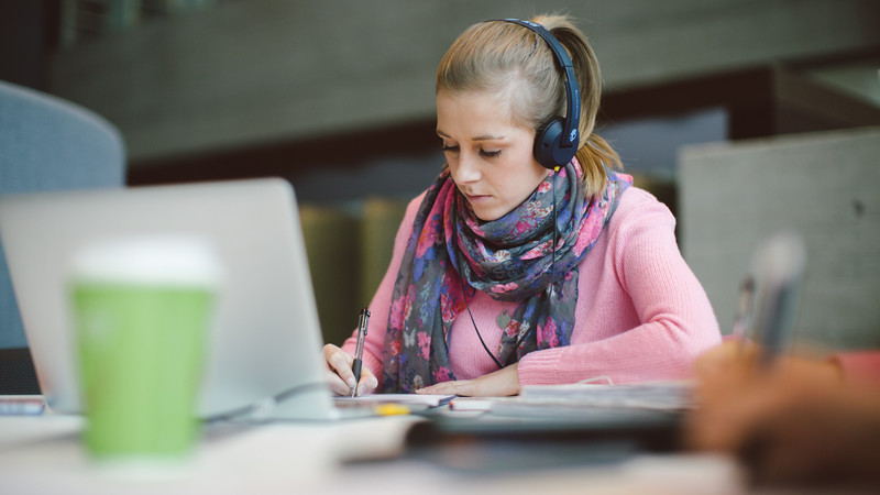 A student working on a laptop